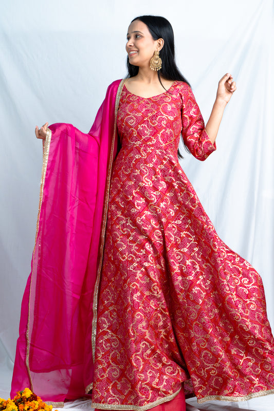 Regal Radiance: Magenta Anarkali Brocade with Lace Accents